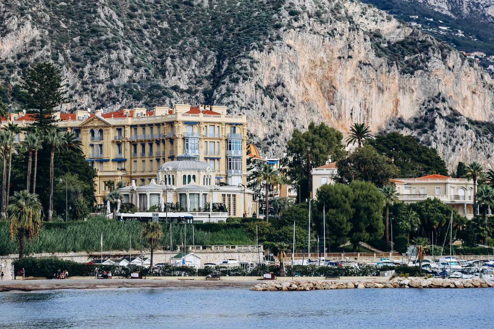 Beaulieu-sur-Mer seen from the sea, its hotels and villas along the shore below the cliffs