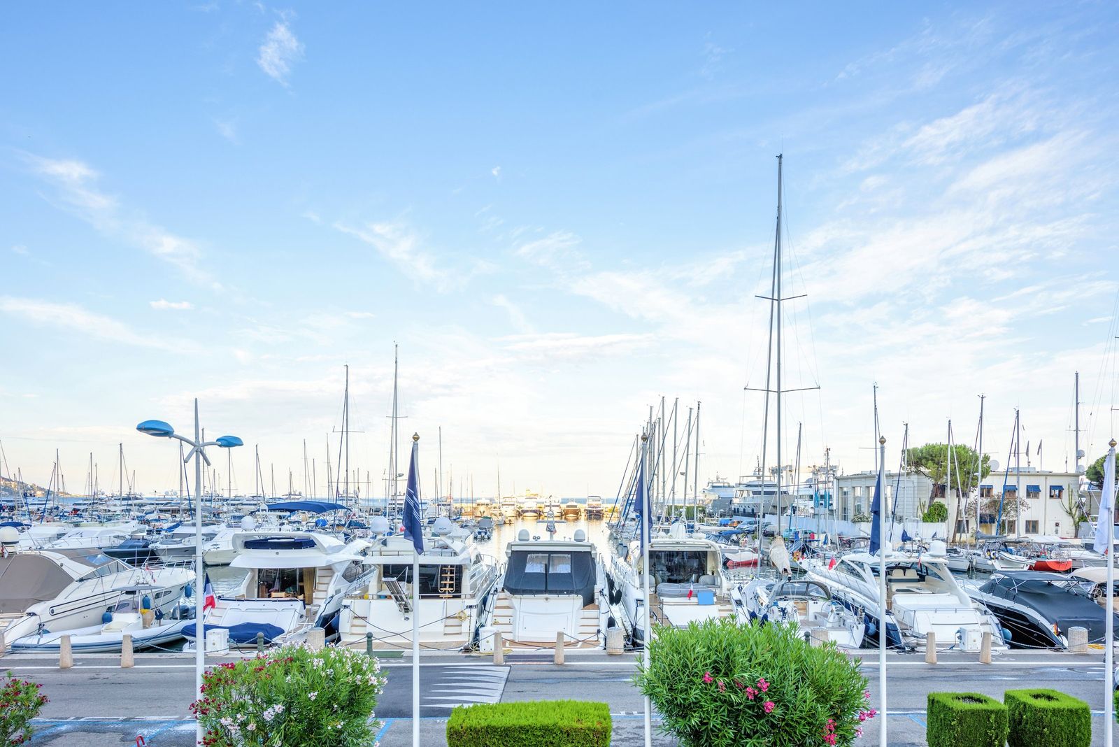 Yachts moored in the port of Beaulieu-sur-Mer on a bright day
