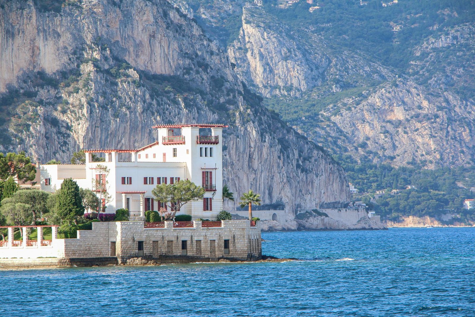 Villa Kérylos, the Greek villa on its rocky point at Beaulieu-sur-Mer, with the cliffs of the Riviera behind