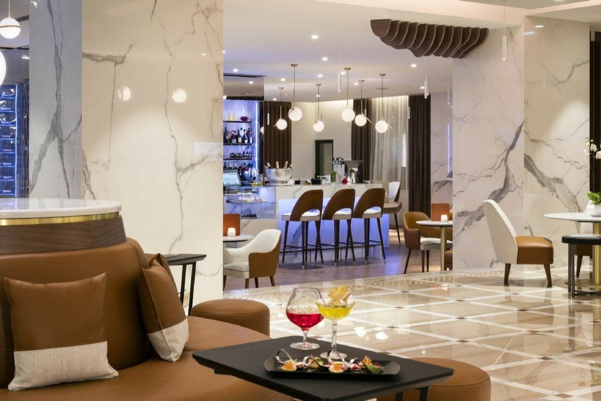 The marble bar and lounge of the Bar du Gray at the Hôtel Barrière Le Gray d'Albion in Cannes