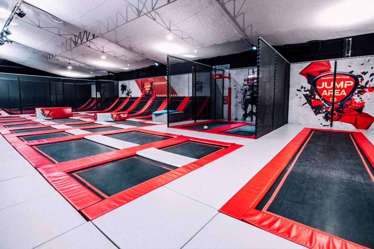 Rows of red-framed trampolines inside Jump Area 06 in Cannes La Bocca
