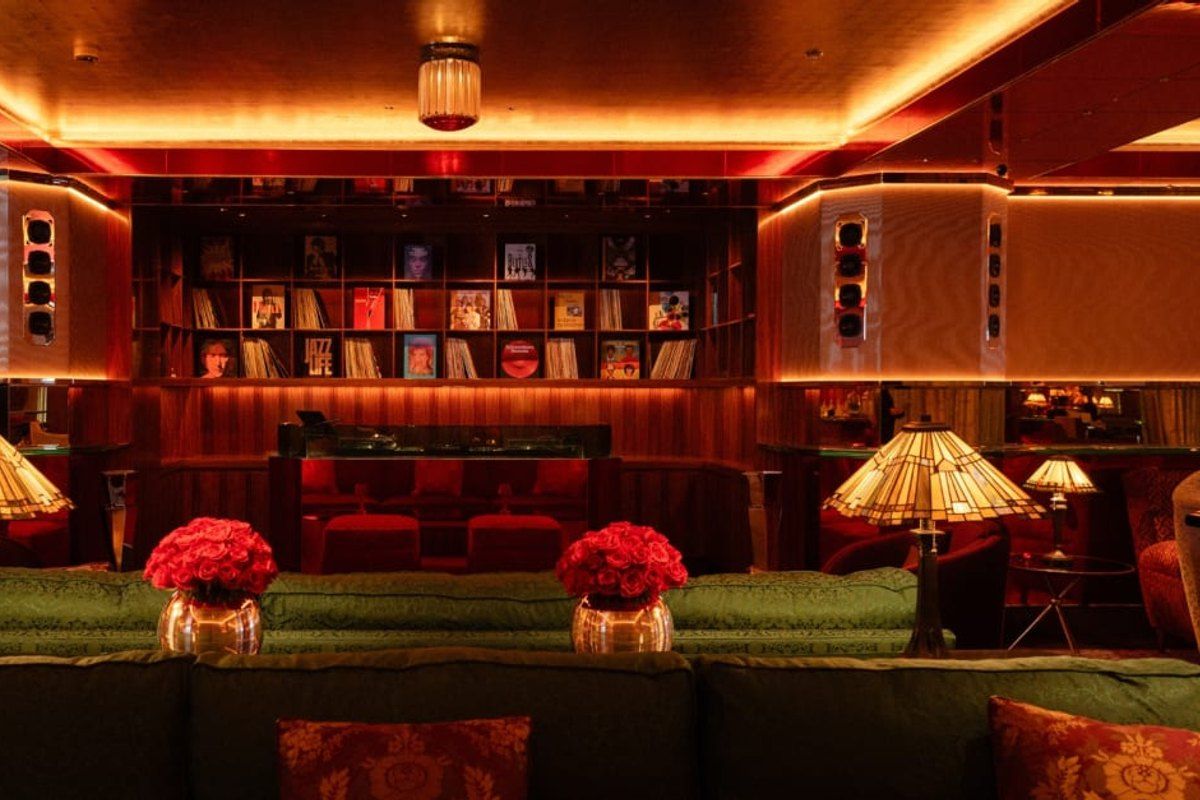 The Martinez Bar at the Hôtel Martinez, red velvet banquettes, Tiffany lamps and a wall of vinyl records