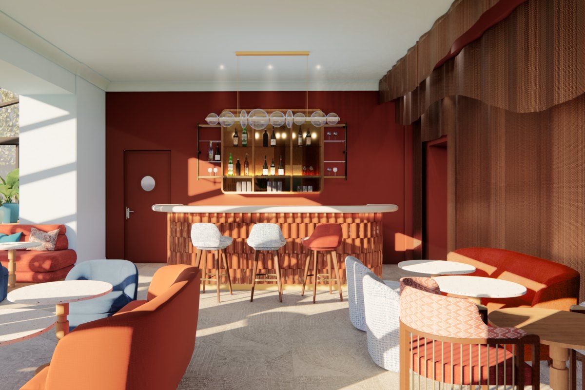The terracotta-toned lounge and bar counter of the Terrarosa Bar at the Hôtel Canberra in Cannes