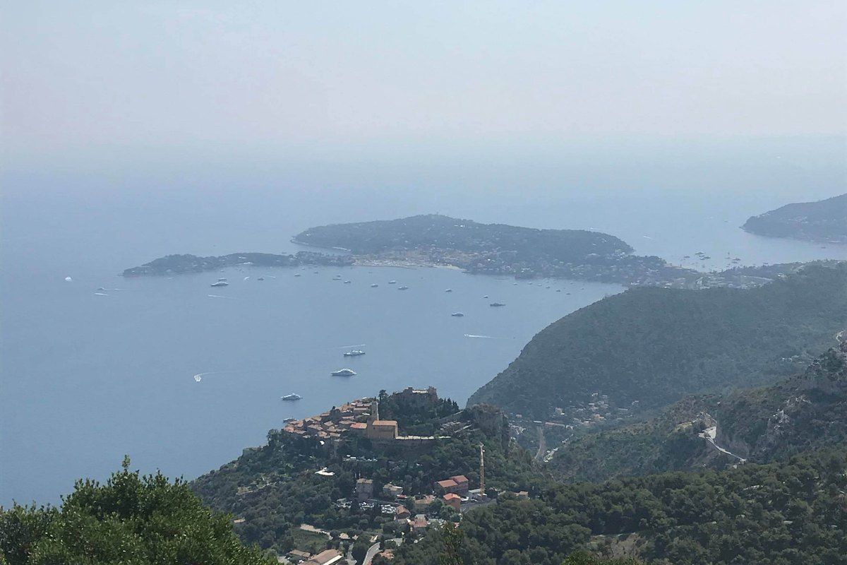 View from the Fort de la Revère down to the perched village of Èze and Cap Ferrat in the haze