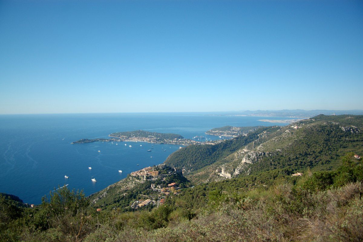 View from the Parc de la Grande Corniche over wooded slopes to the sea and Cap Ferrat