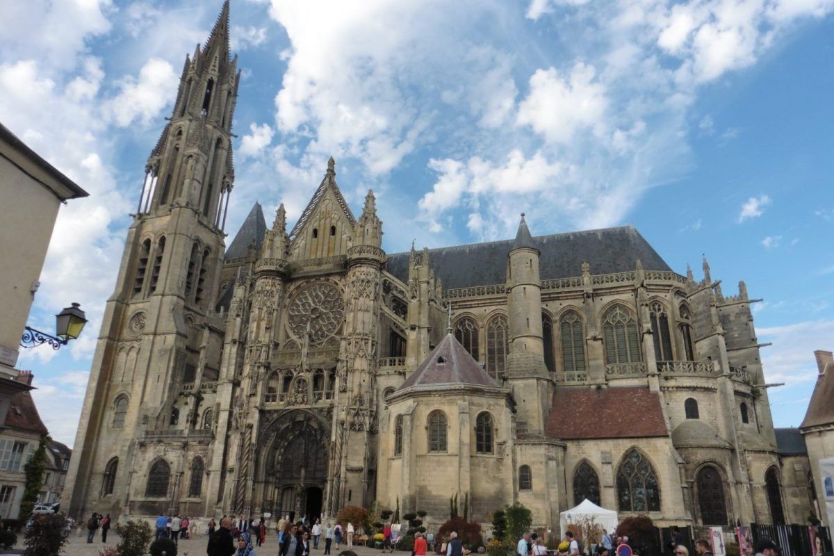 The Gothic chevet of Notre-Dame de Senlis above a formal box garden
