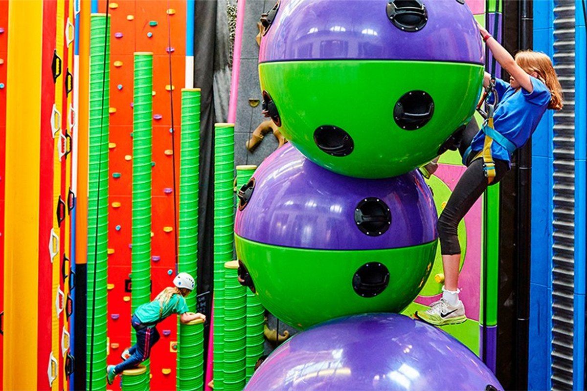 Children scaling colourful Clip'n Climb walls and giant stacked balls at Airtrix in Nordhavn