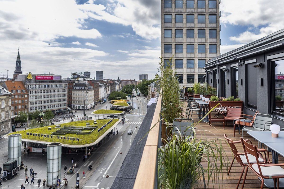 The Level Six rooftop terrace above Nørreport station, looking out over the green station roofs and the city's spires