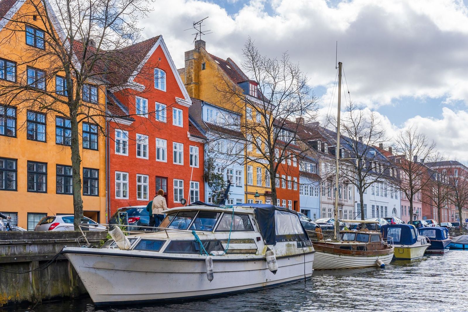 Houses and moored boats along a canal in Christianshavn