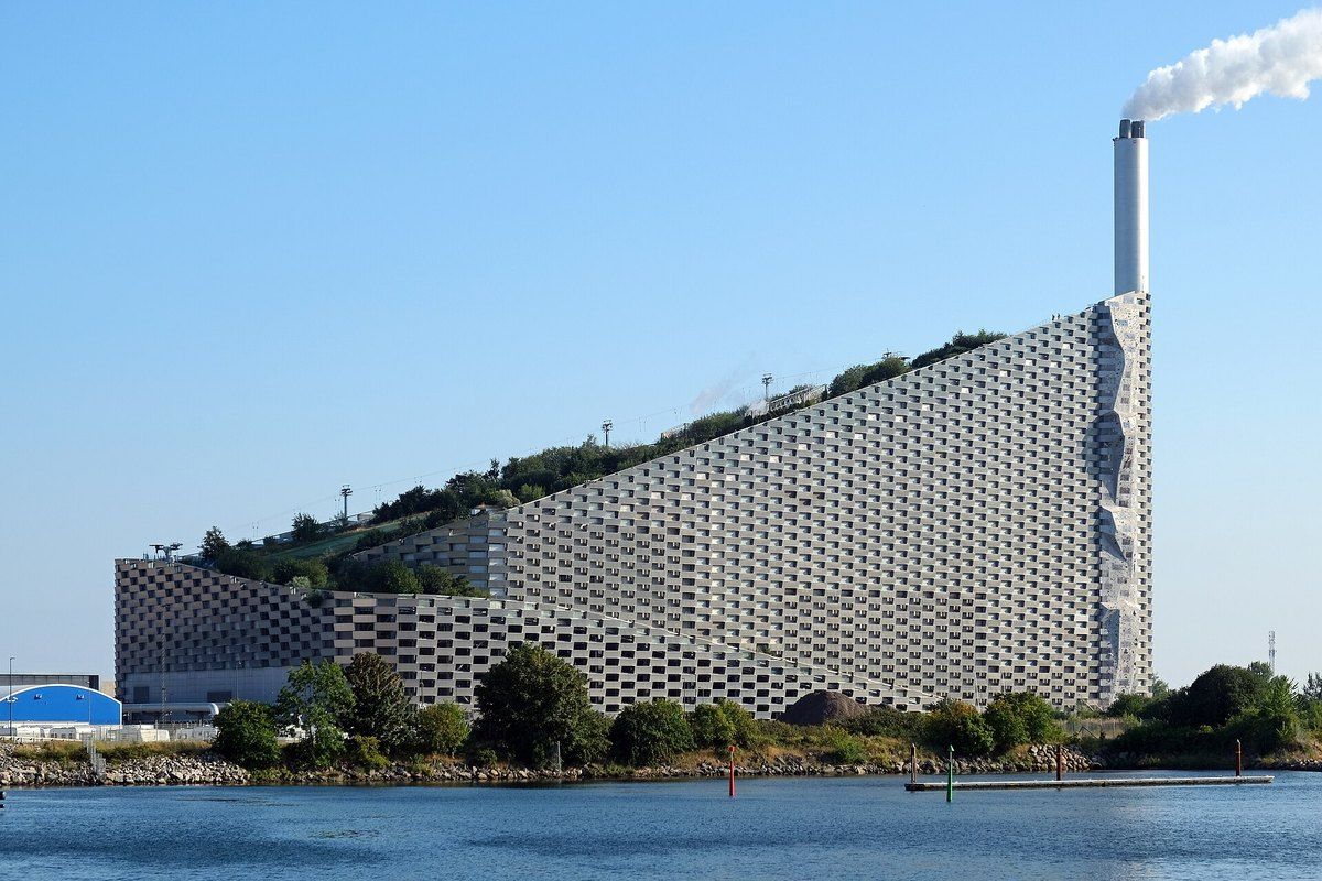 CopenHill, the power plant with a ski slope and green roof rising above the water at Amager