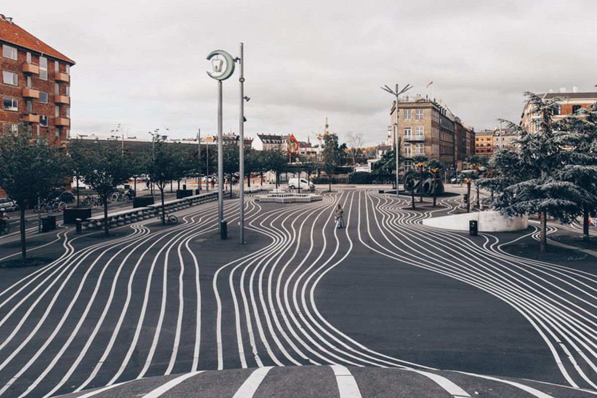 The curving white lines painted across the black asphalt of Superkilen's Black Market square in Nørrebro