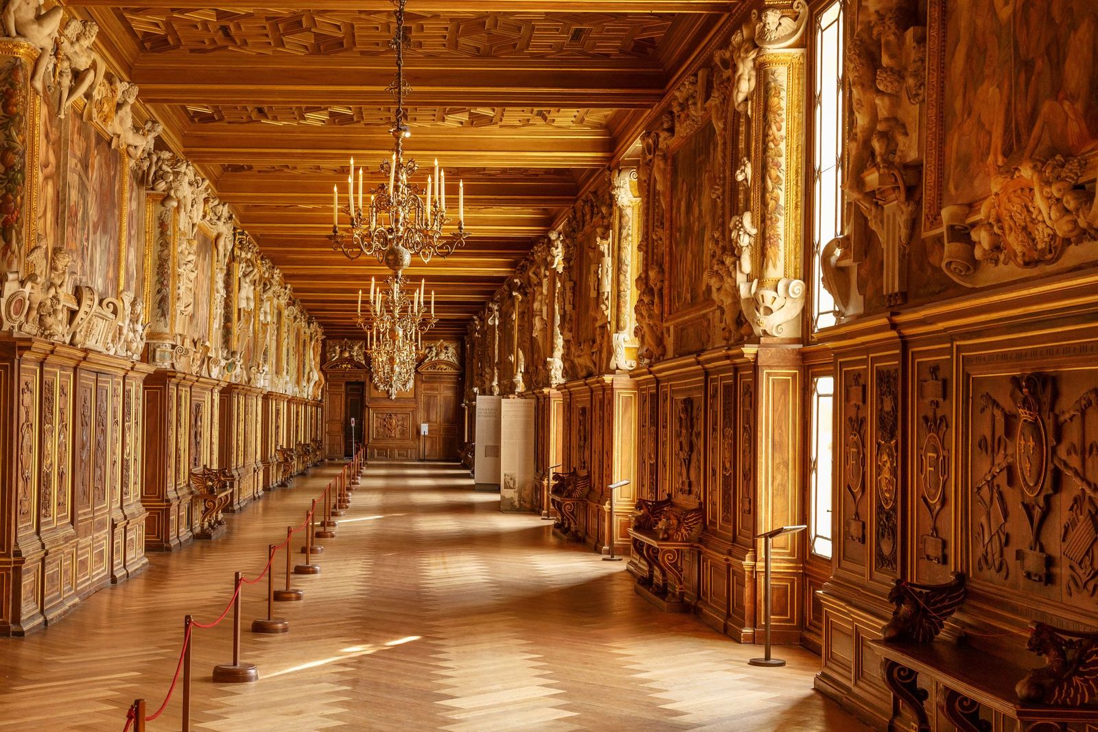 A carved and gilded gallery inside the Château de Fontainebleau
