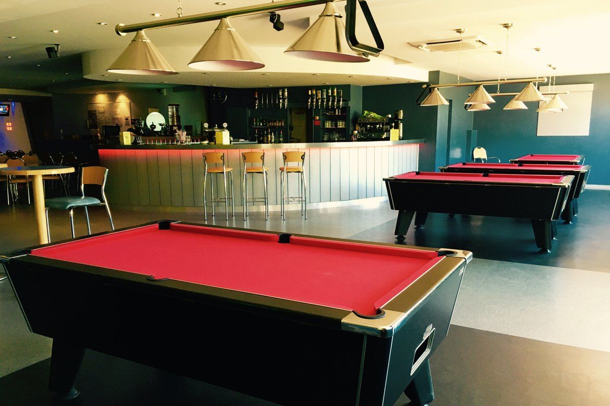 Pool tables and the bar at the Bowling du Golfe in Grimaud