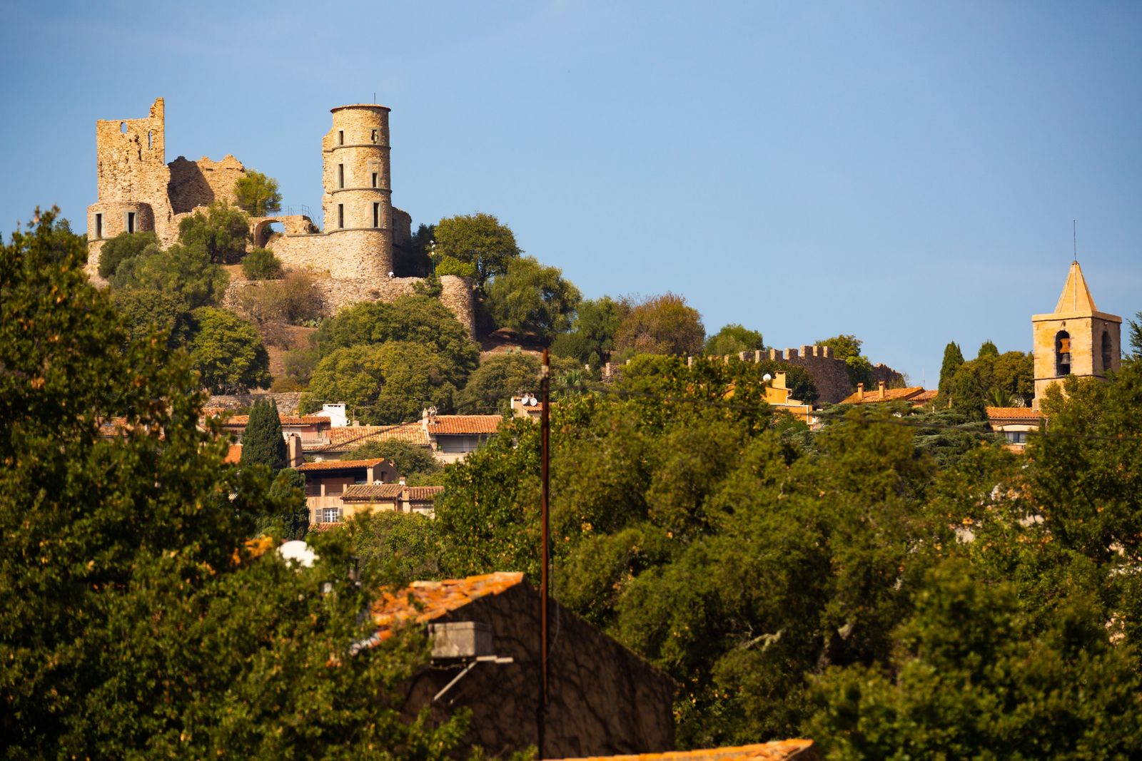 The ruins of the castle of Grimaud above the village rooftops