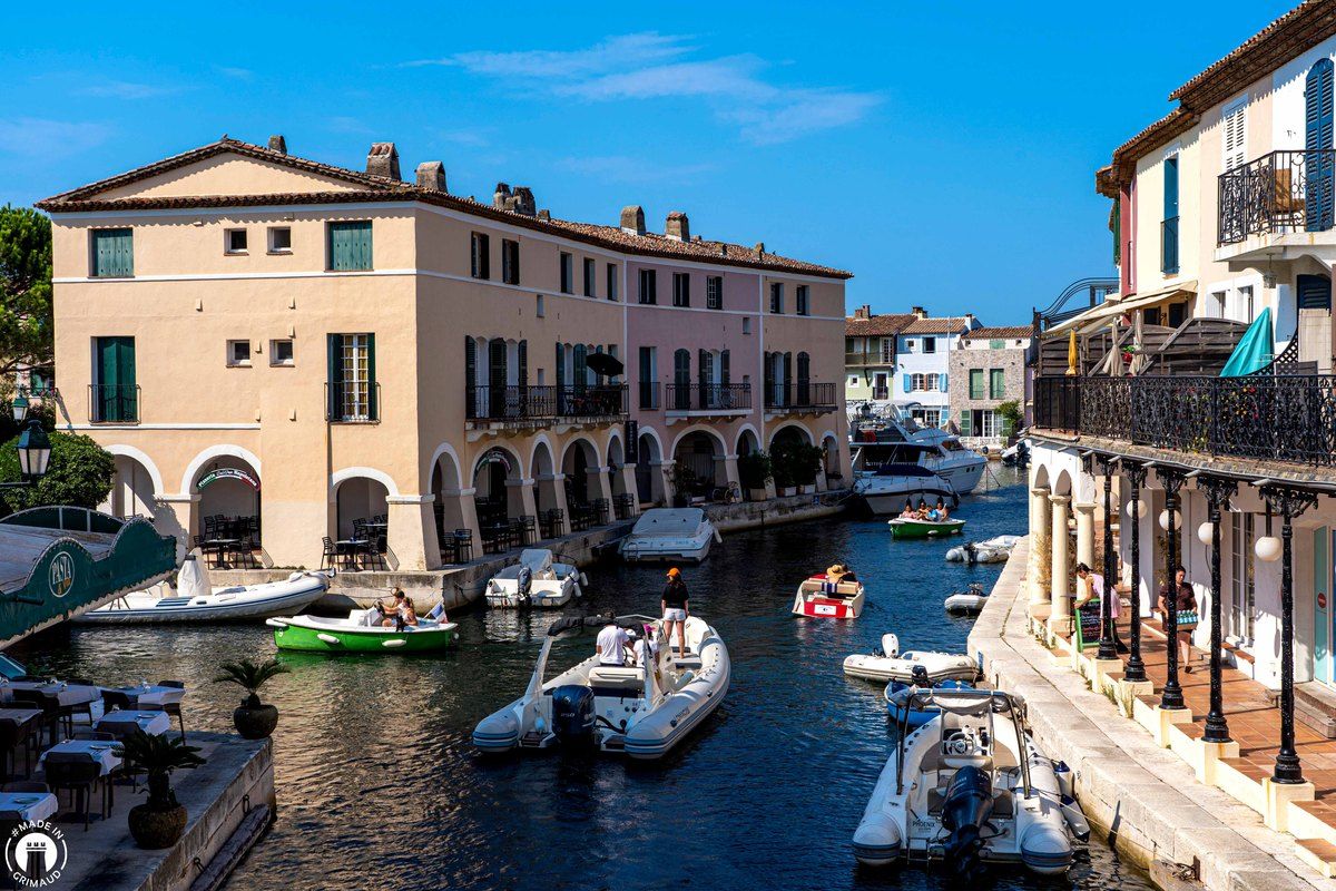 Arcaded houses and small boats on a canal in Port Grimaud
