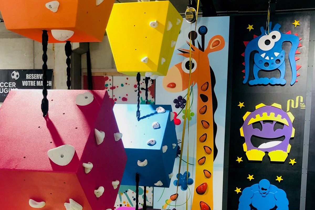Colourful climbing walls decorated with cartoon monsters at Circus Grimp in Mougins
