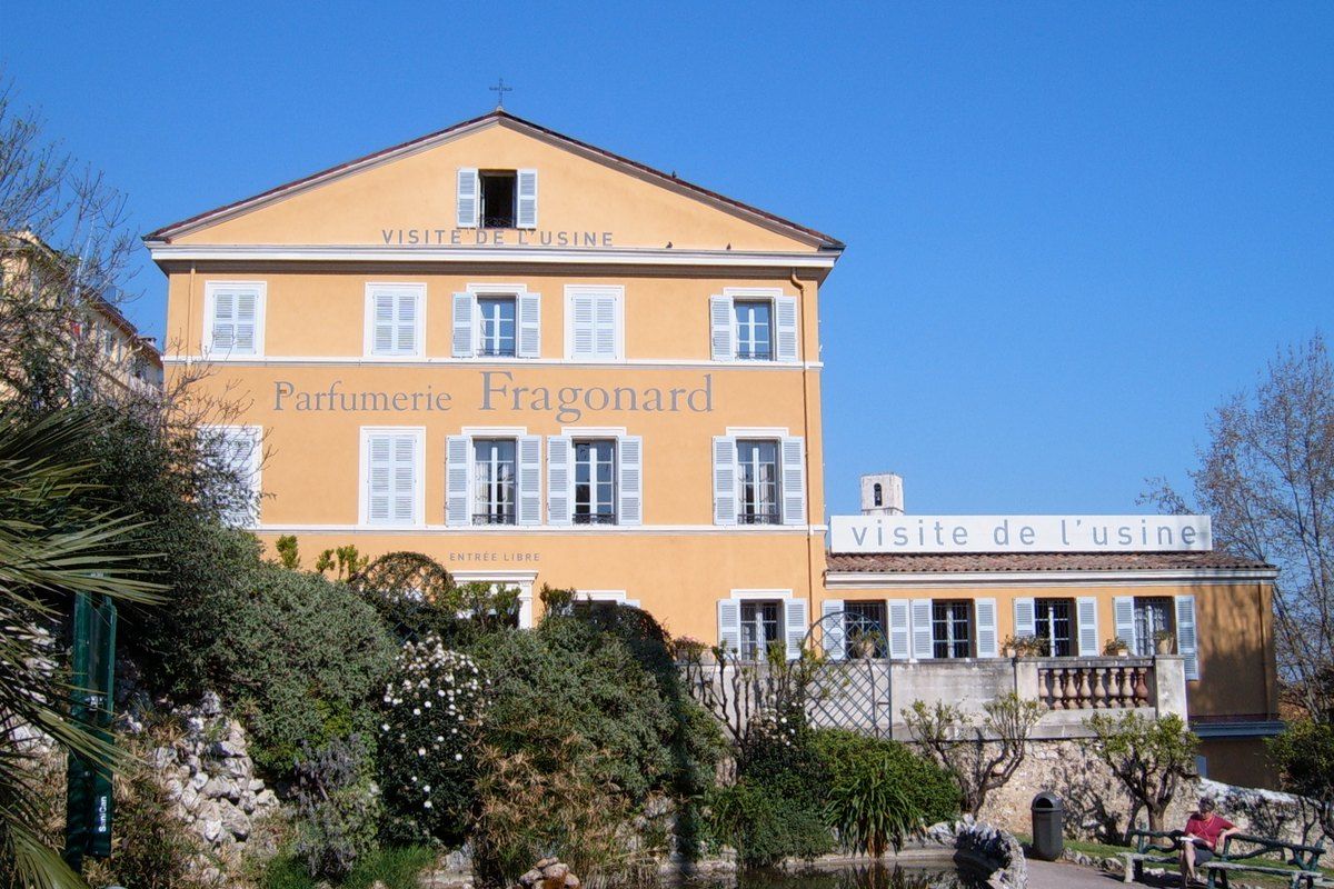 The ochre façade of Fragonard's historic perfume factory in the old town of Grasse
