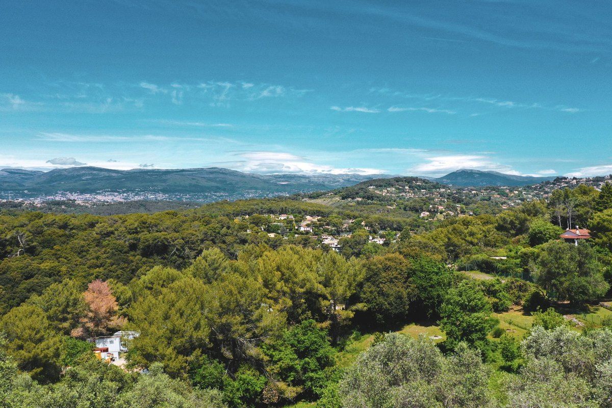 Wooded hills seen from Gour de Coule in Le Cannet, rolling towards the mountains