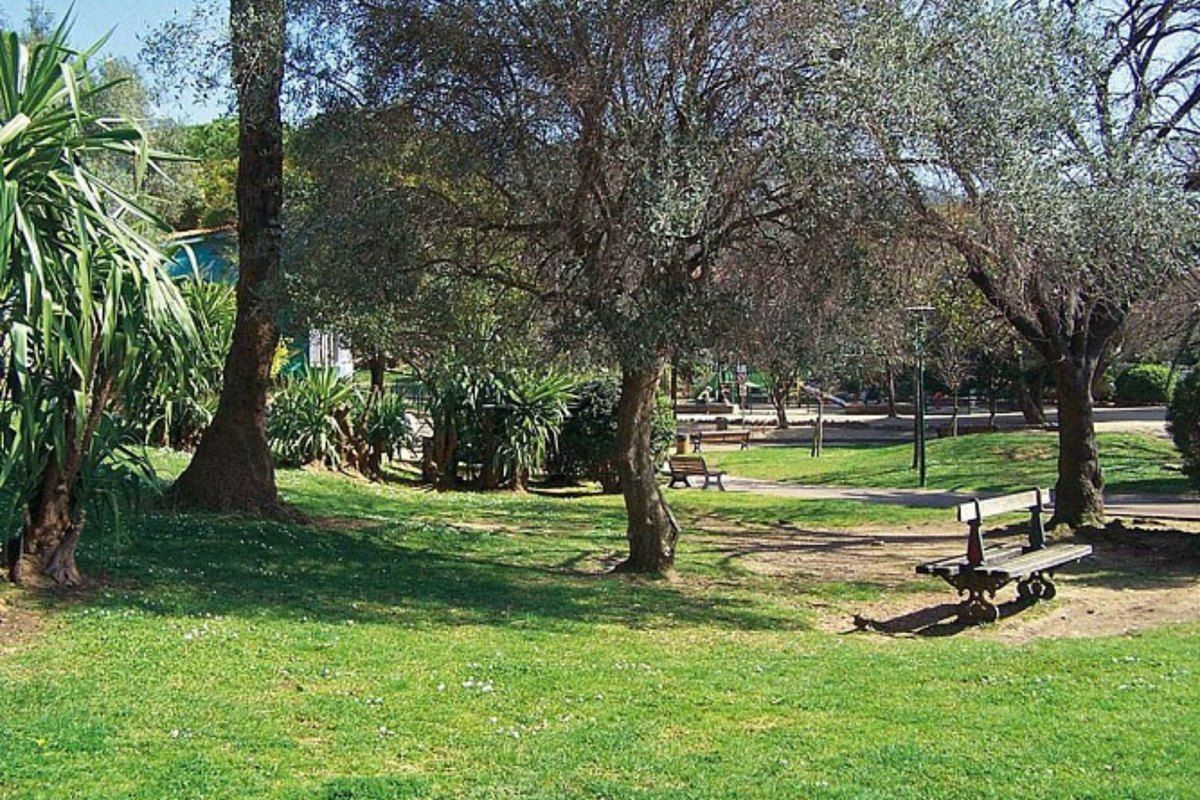 The playground among olive trees and palms in the Jardin du Tivoli, Le Cannet