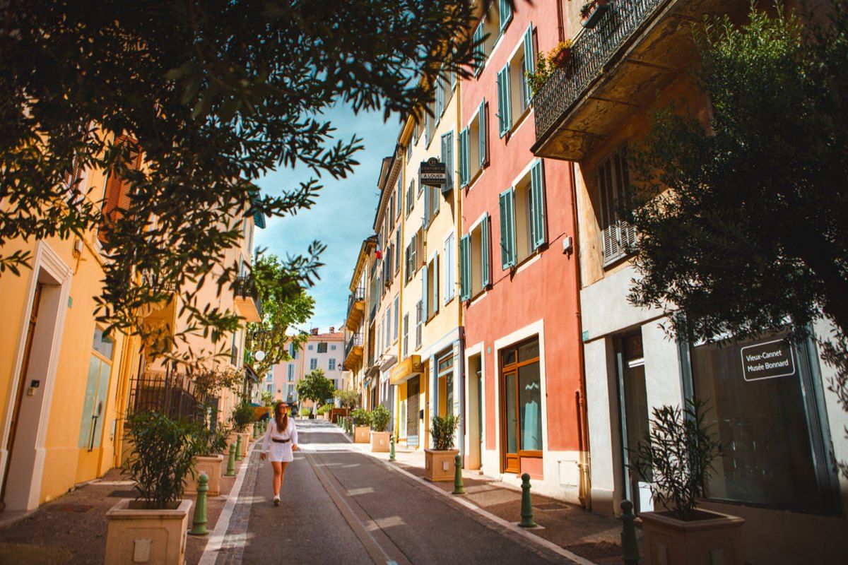 A sunny lane of colourful houses in the Vieux-Cannet