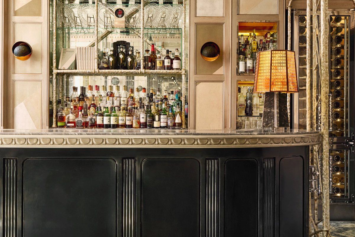 The mirrored back bar of the Connaught Bar in Mayfair, lined with spirits and glassware