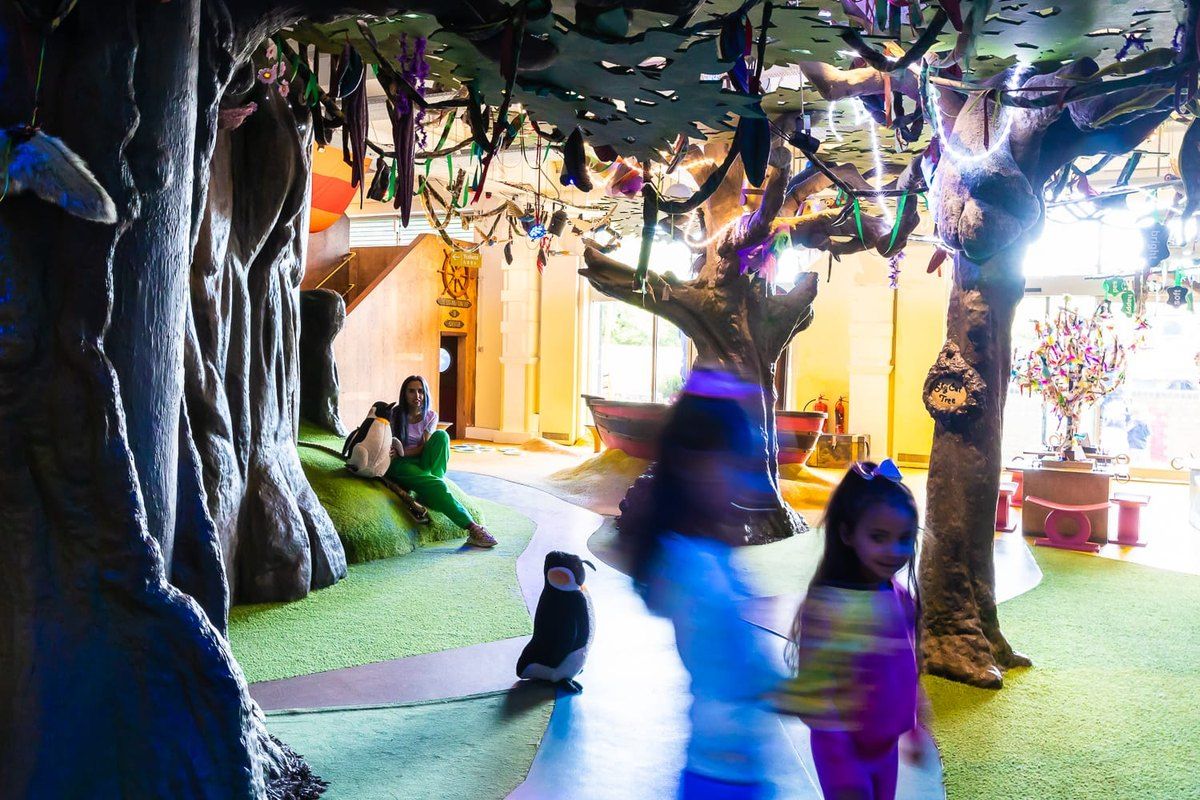 Children exploring the Ground Floor Story World at Discover Children's Story Centre in Stratford