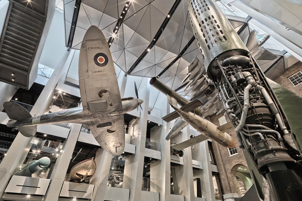 A Spitfire and a V-2 rocket hanging in the atrium of IWM London