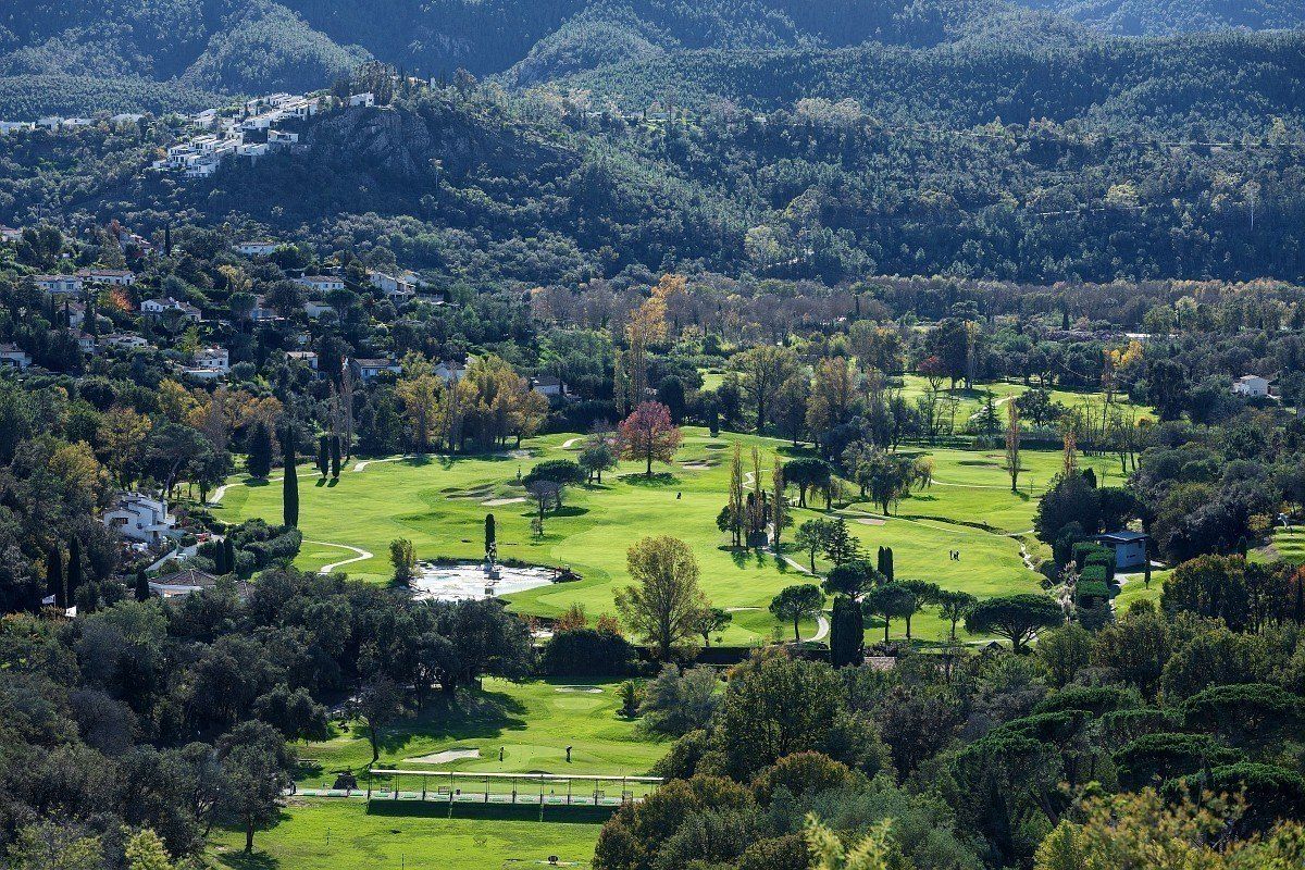 Fairways and pines of the Riviera Golf de Barbossi below the Estérel hills, seen from above