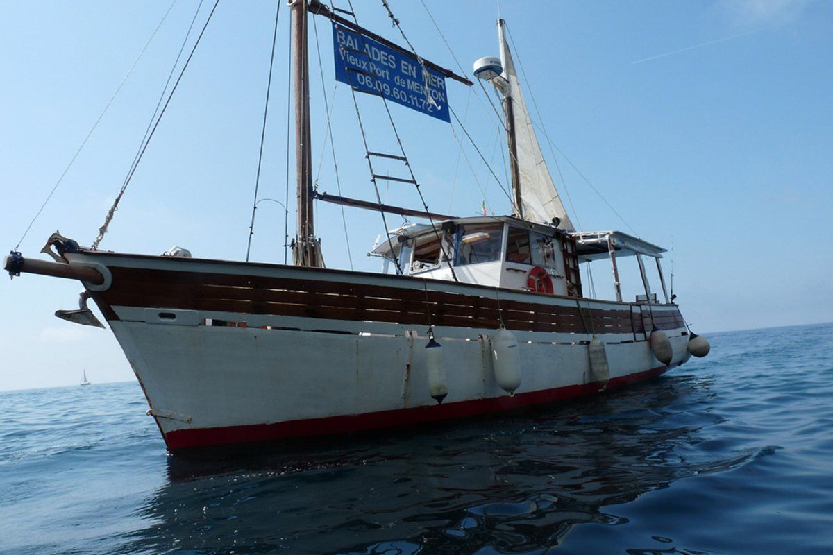 The wooden boat Le Brigantin of La Balade en Mer Mentonnaise at sea off Menton