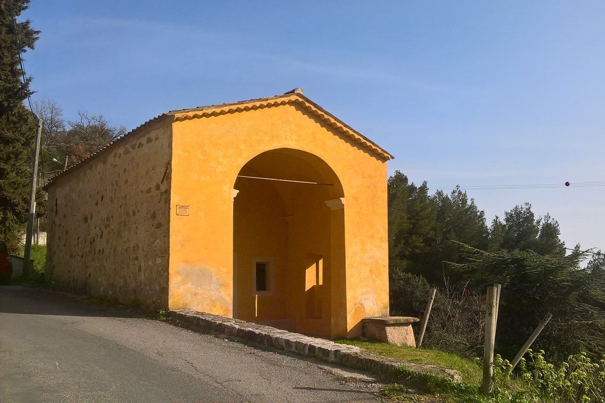 The ochre arched Chapelle Saint-Roch at Castellar, start of the footpath down to Menton
