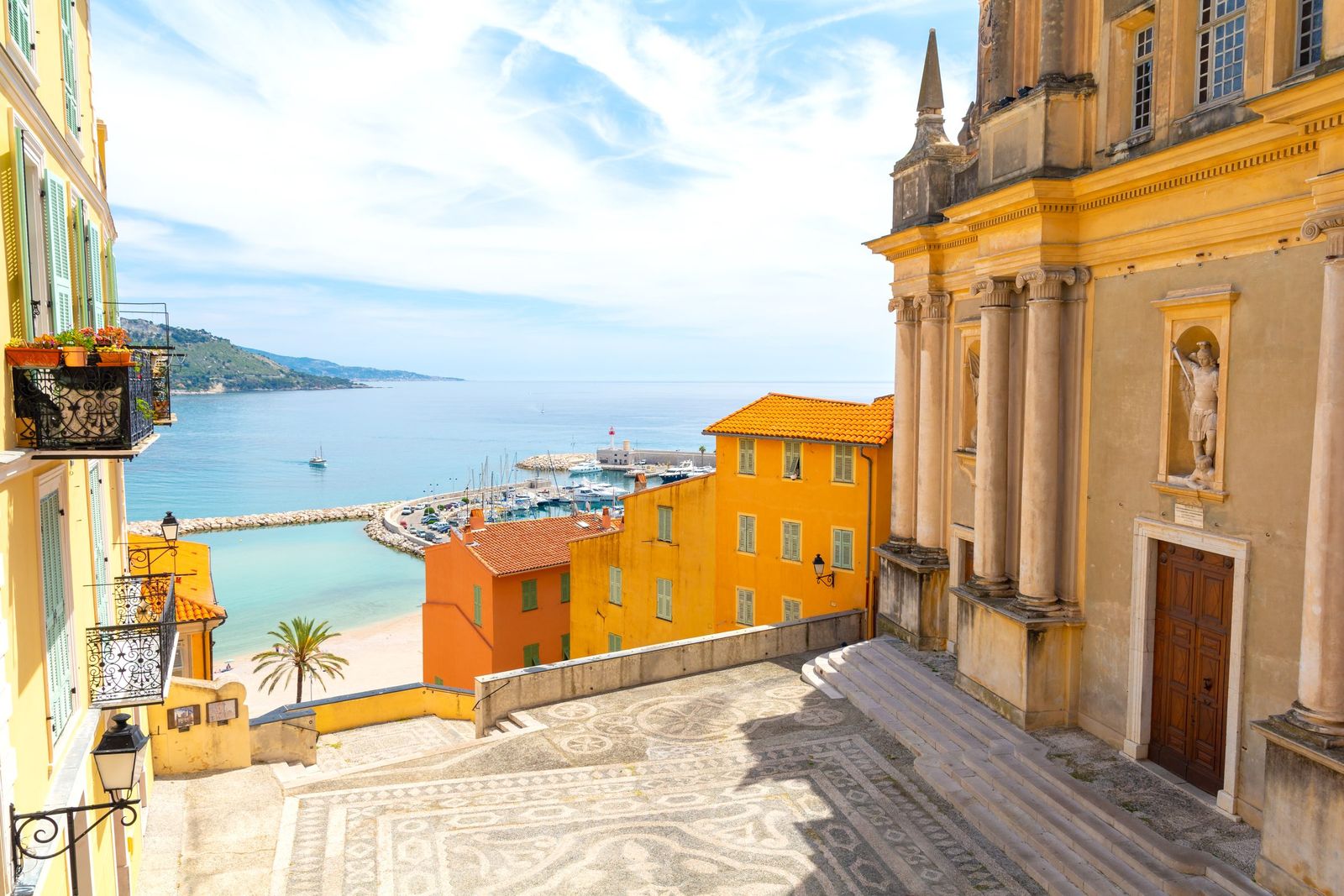 A small square in the old town of Menton with the facade of the old church