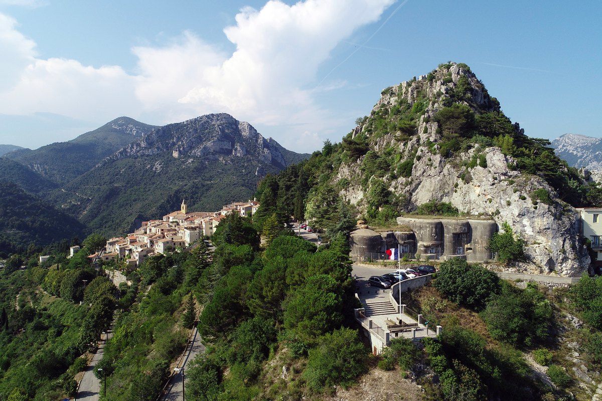 Aerial view of the perched village of Sainte-Agnès and its fortifications on a rocky spur above Menton