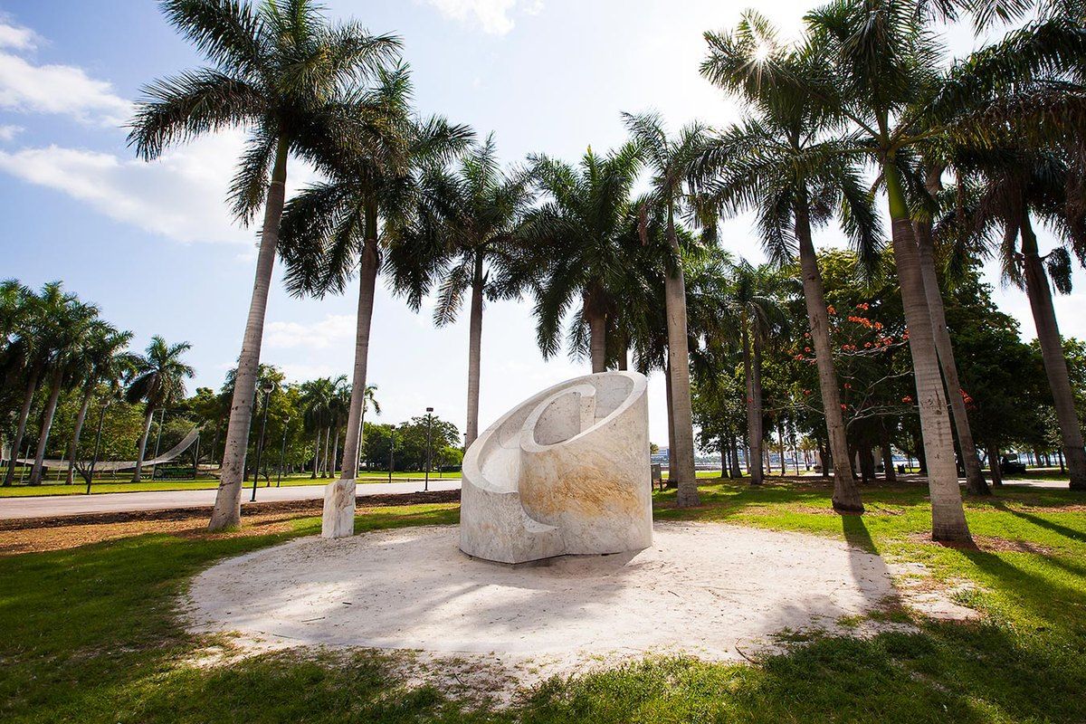 Isamu Noguchi's white marble Slide Mantra among the palms of Bayfront Park