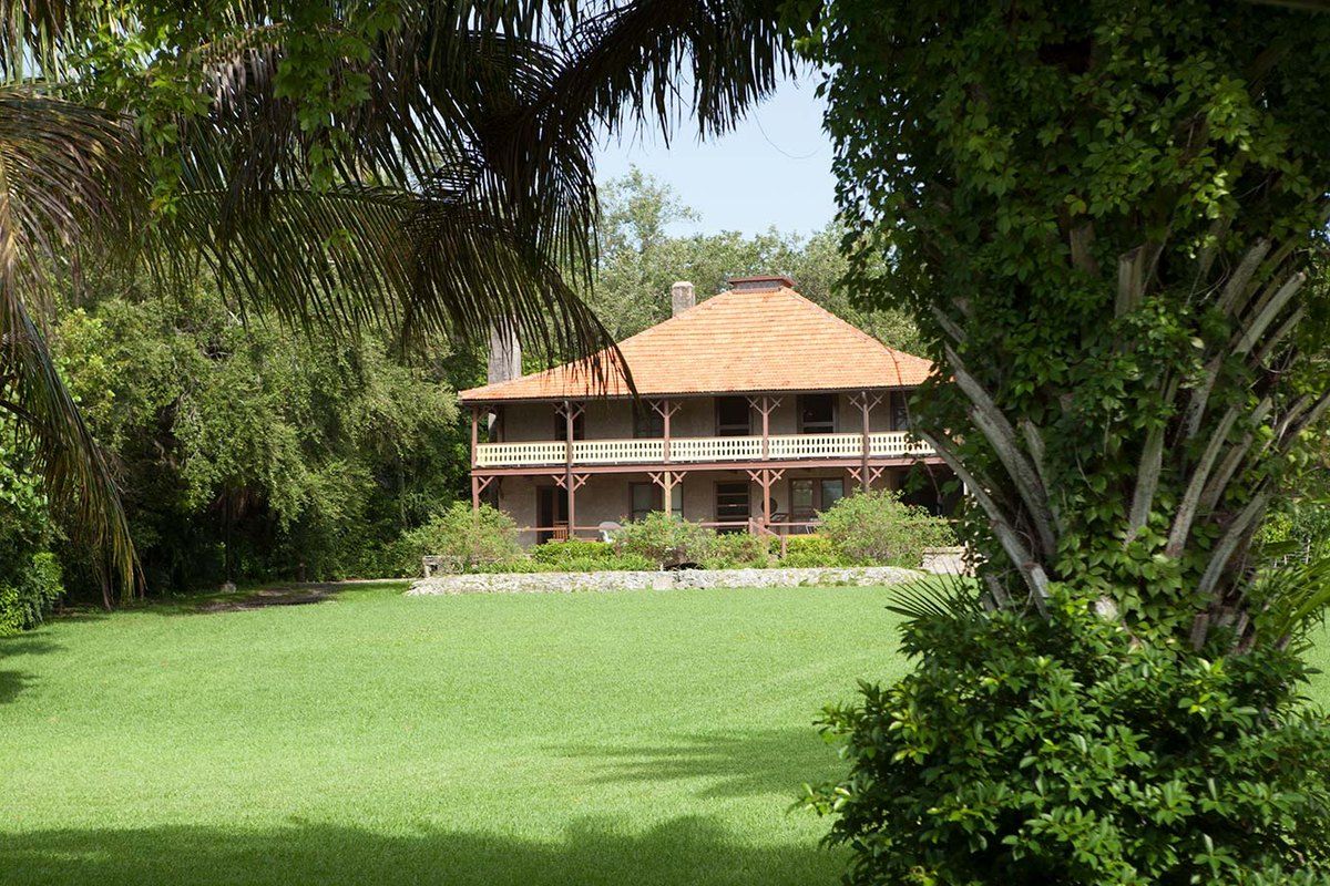 The 1891 Barnacle house with its wide verandas across the lawn in Coconut Grove