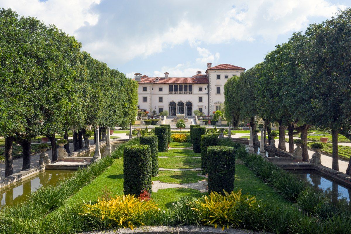 Clipped hedges and canals in the formal gardens leading to the Vizcaya villa