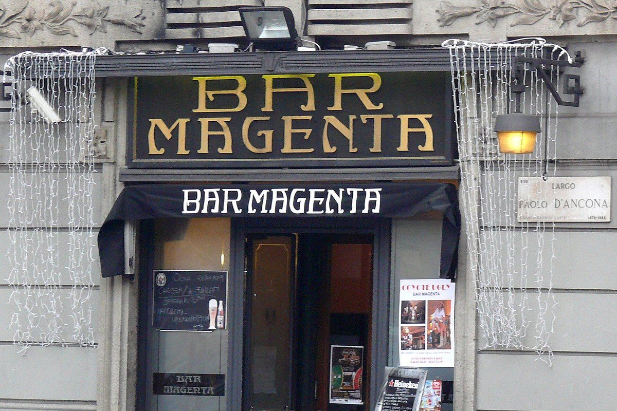 The gilded sign and doorway of Bar Magenta on Largo Paolo d'Ancona, Milan
