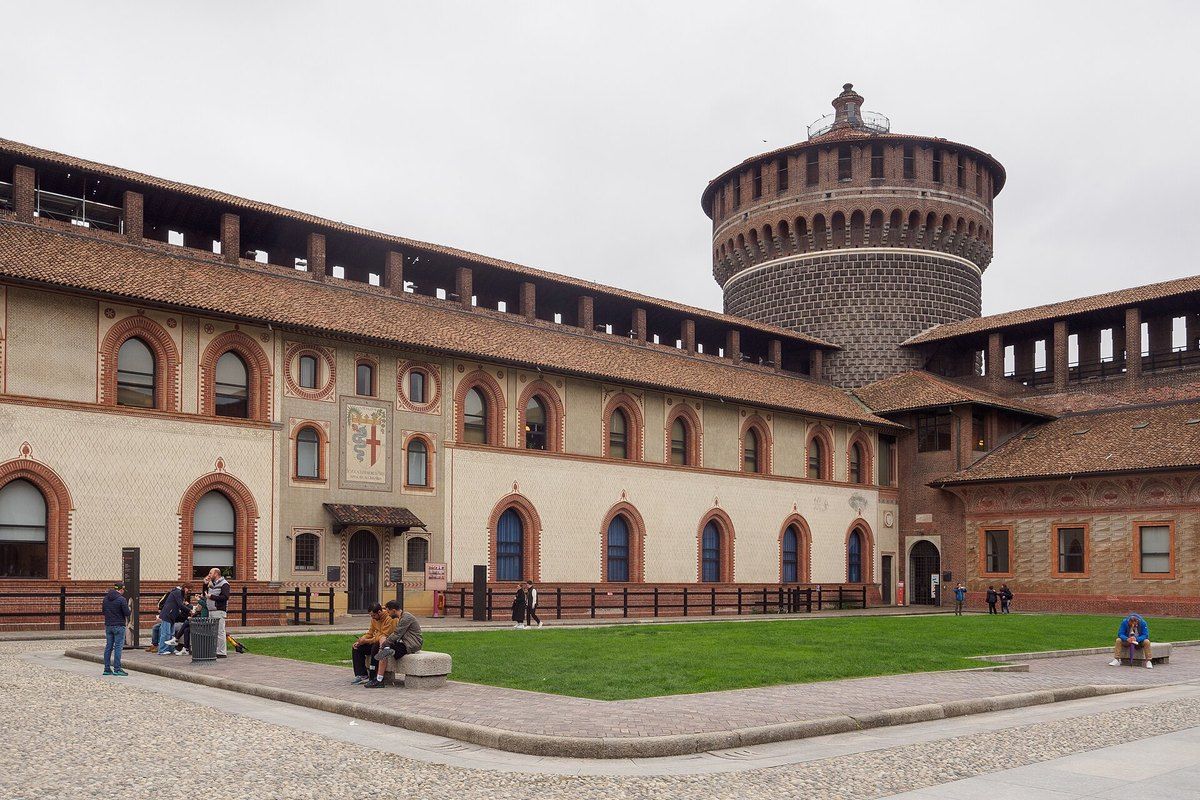 The Cortile delle Armi of the Castello Sforzesco with its round corner tower on an autumn day