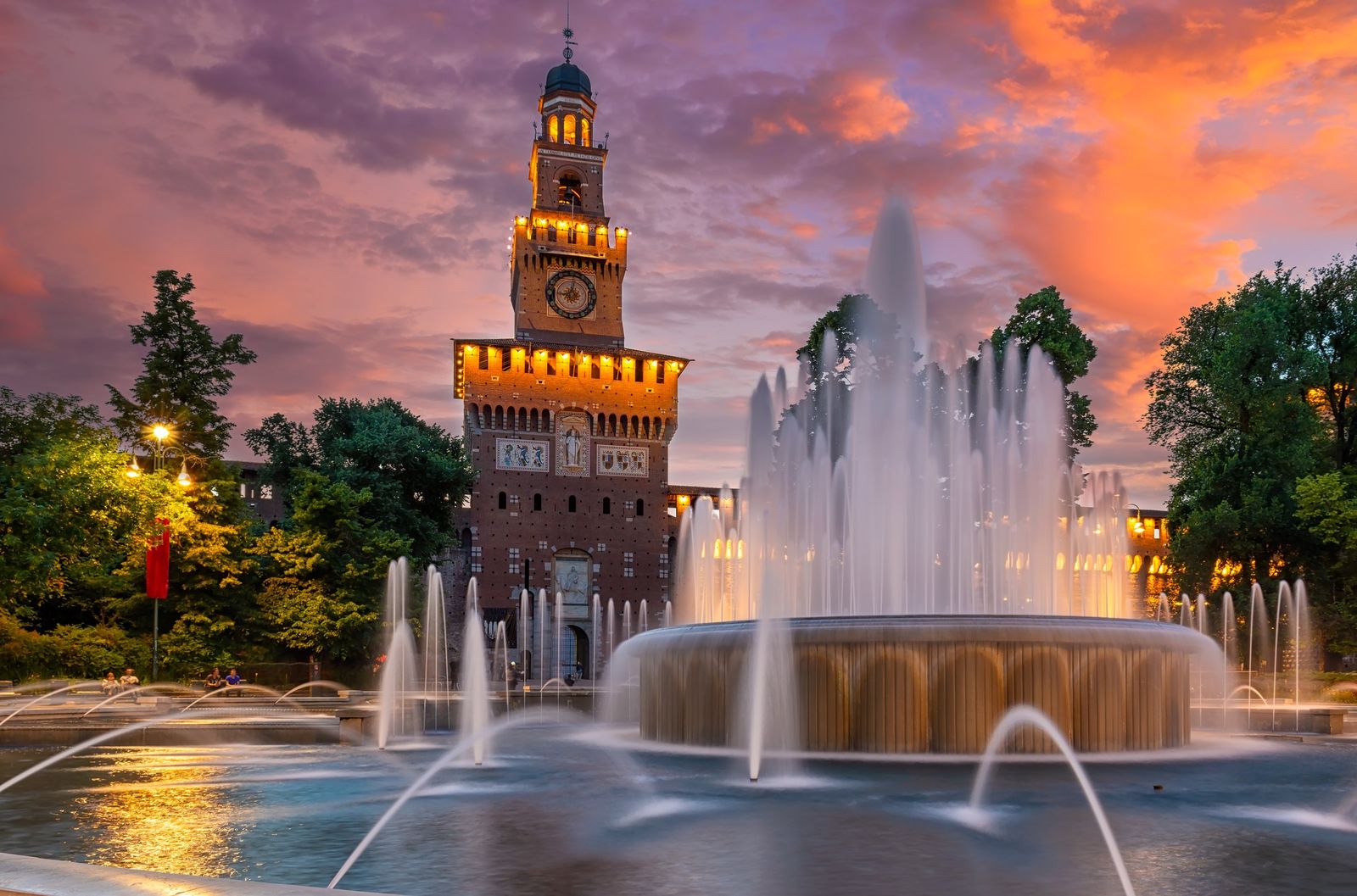 Castello Sforzesco and its fountain at sunset