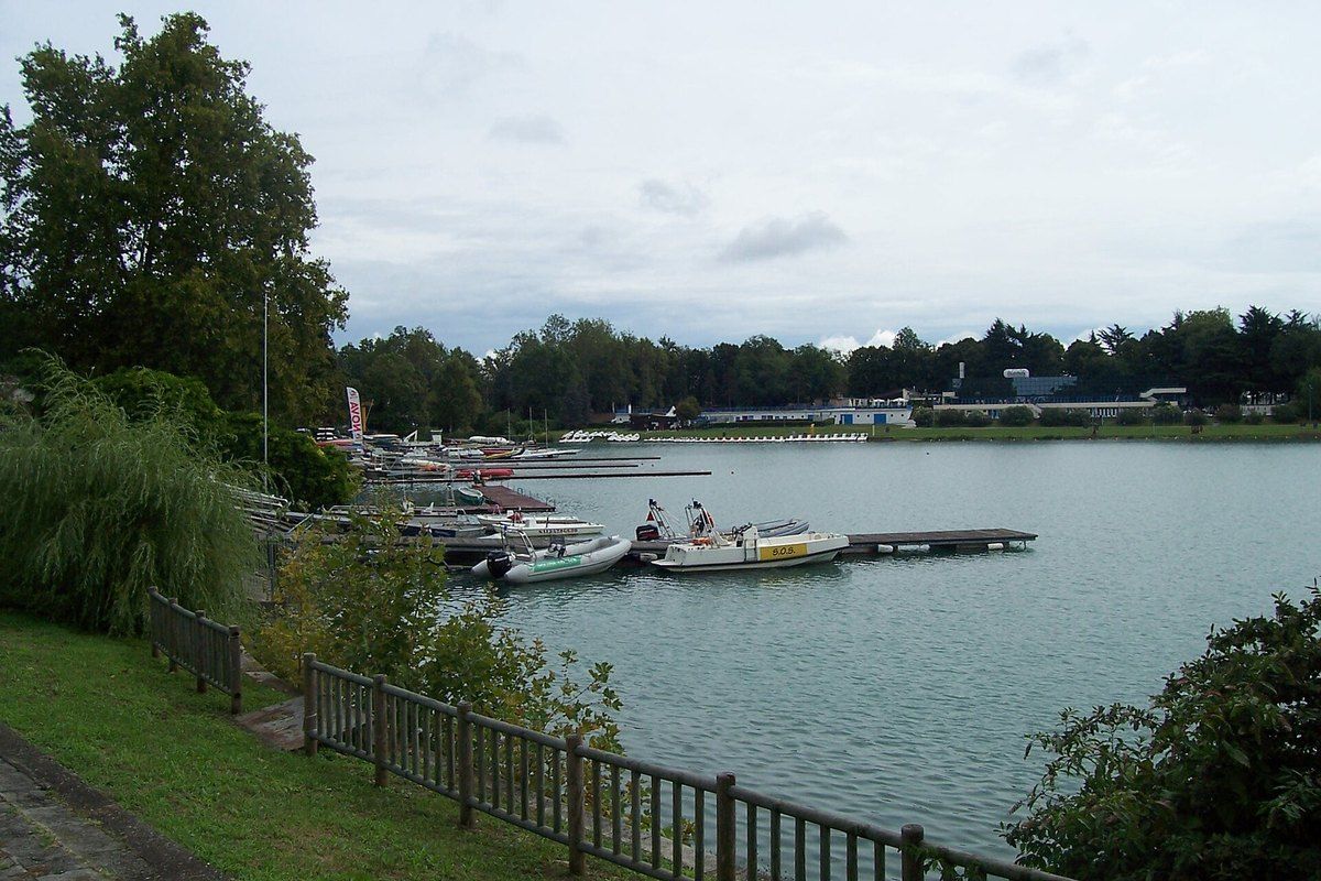 Moored rowing boats and the long basin of the Idroscalo, Milan's 'seaside'