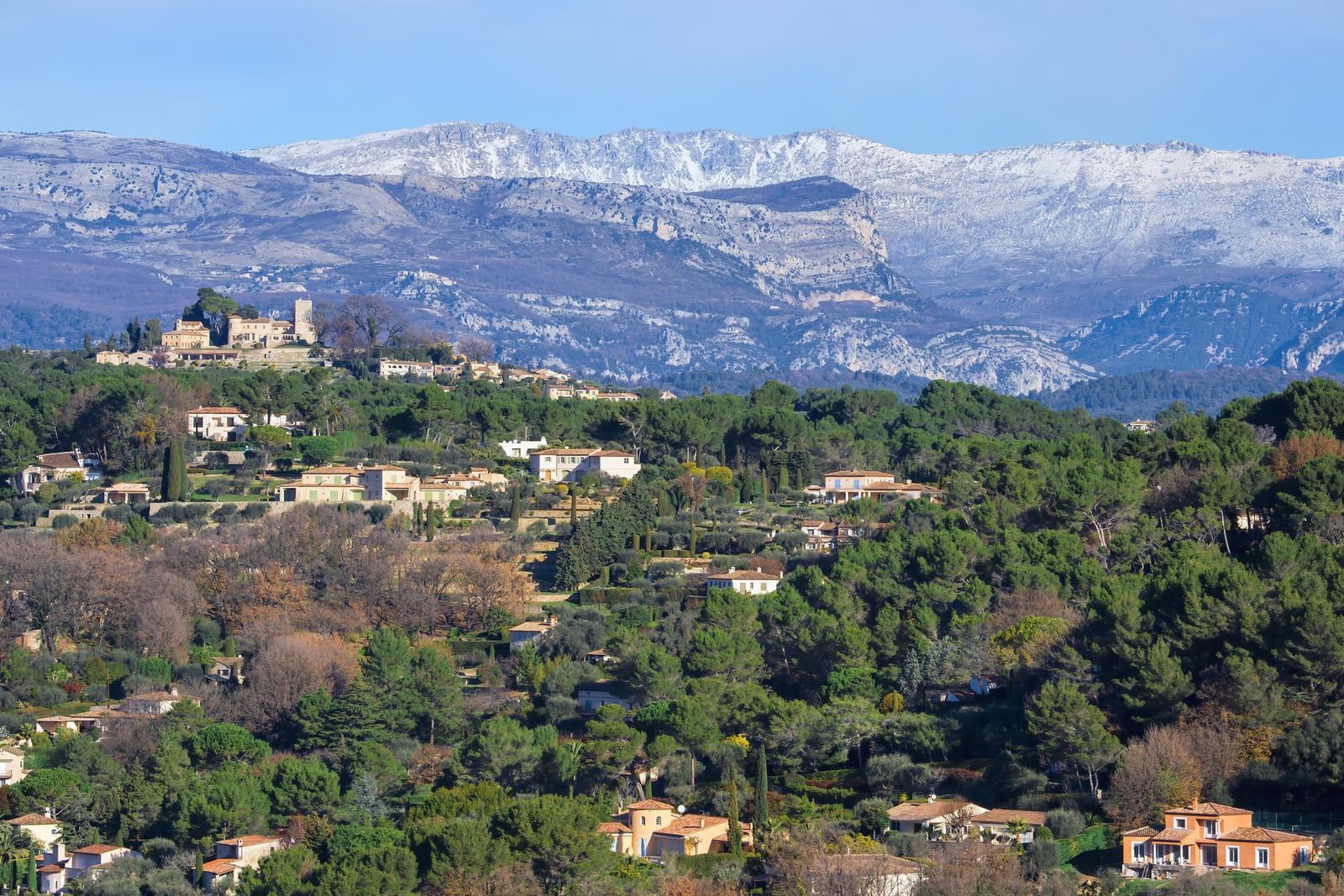 The old village of Mougins with the snow-capped Alps beyond