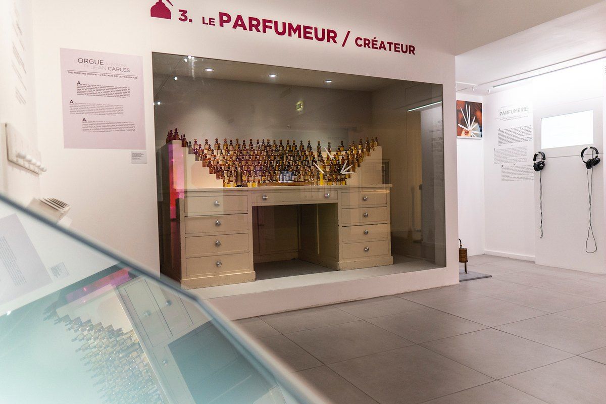 A bright gallery of the International Perfume Museum in Grasse with perfume-making displays