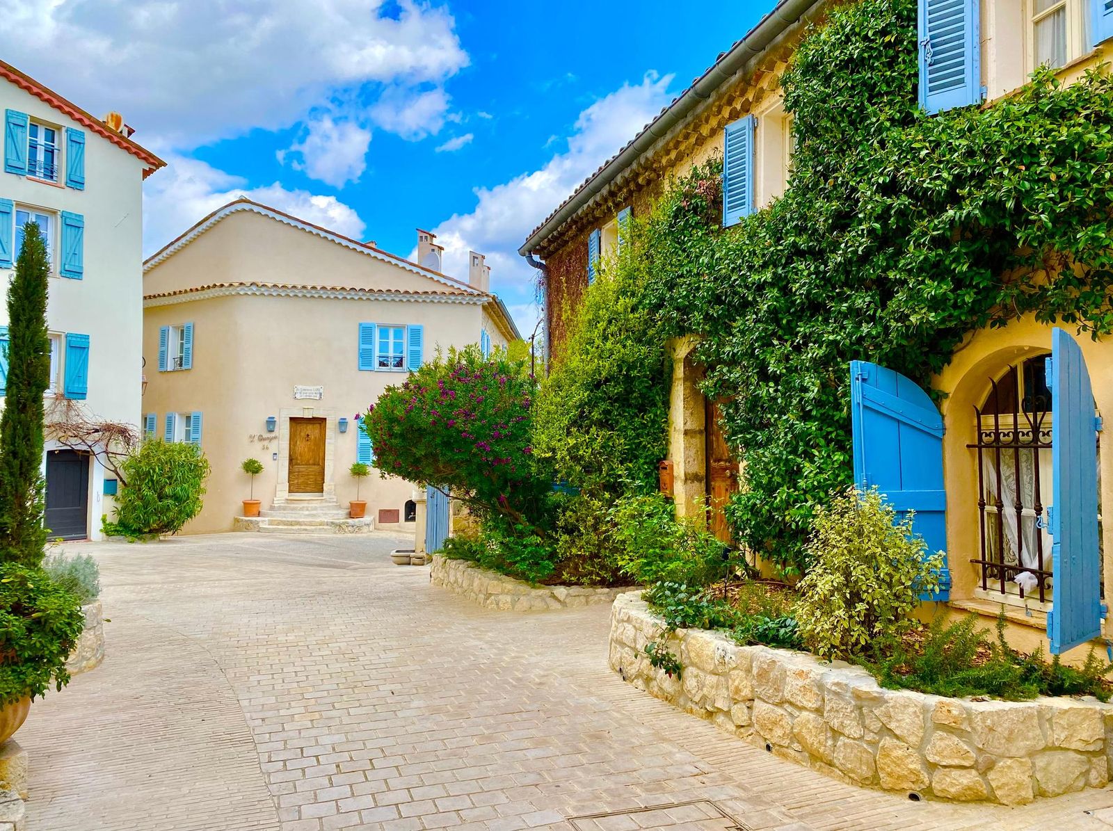 A square of shuttered houses in the old village of Mougins