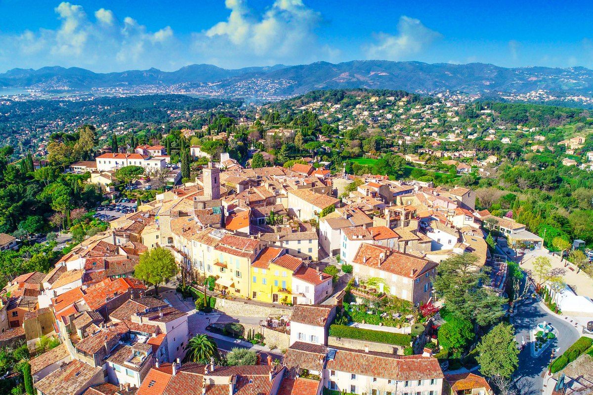 Aerial view of the perched old village of Mougins and the green hills around it