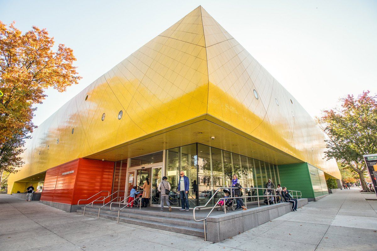 The yellow, tiled exterior of the Brooklyn Children's Museum in Crown Heights
