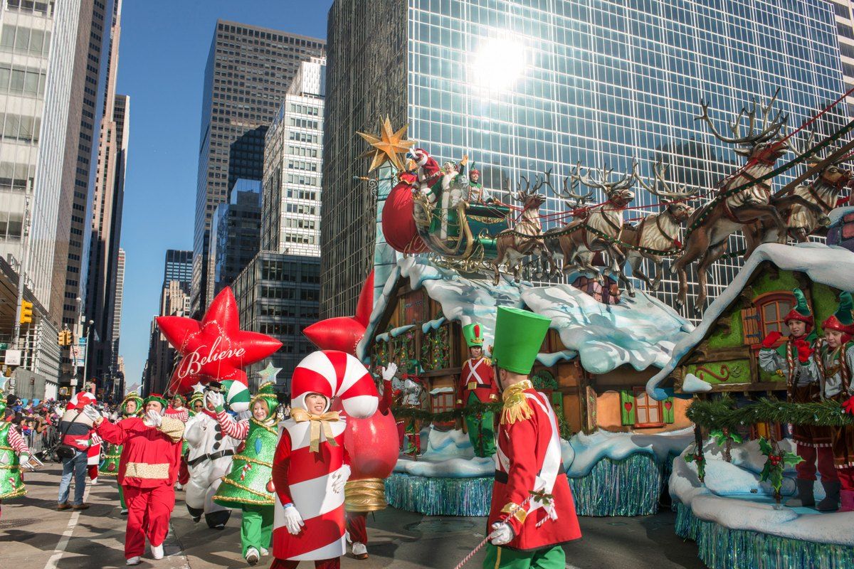 Costumed performers and a festive float in the Macy's Thanksgiving Day Parade