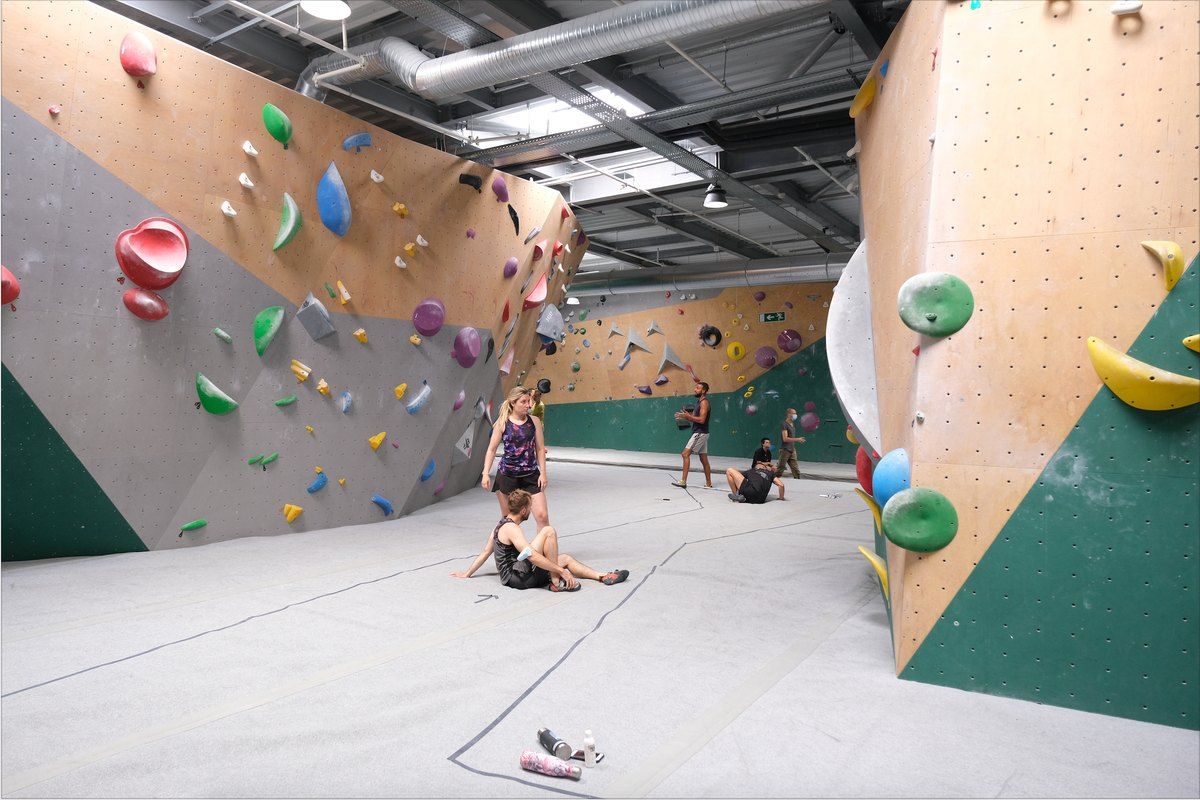 Colourful bouldering walls in the two-storey Arkose climbing loft in Nice