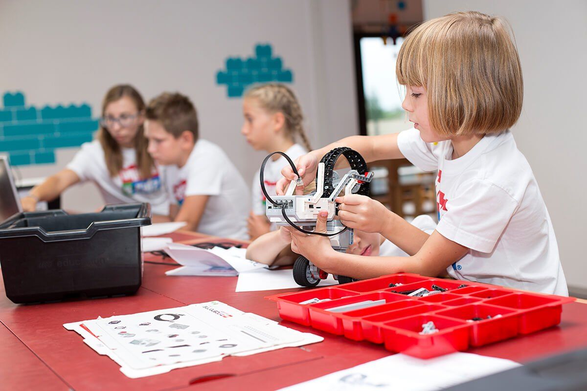 Children building and programming LEGO robots at a Bricks 4 Kidz workshop in Nice