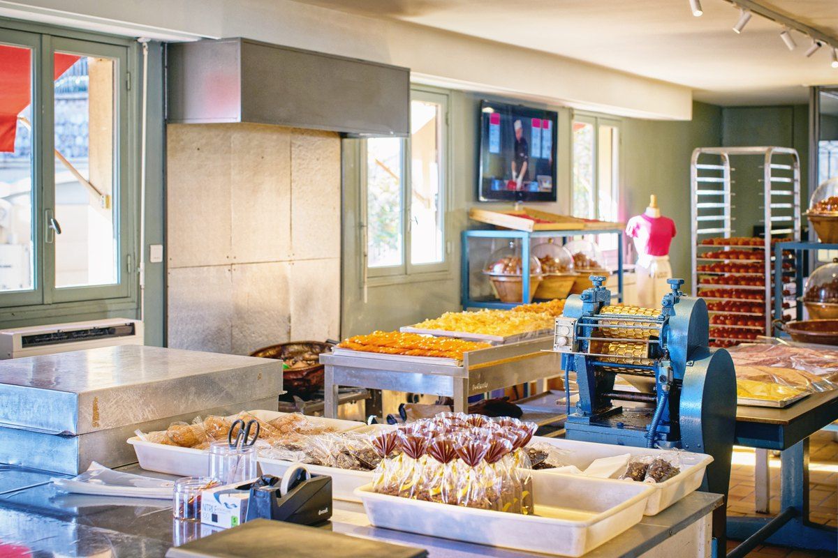 Trays of candied fruit and sweets in the workshop of the Confiserie Florian on the port of Nice