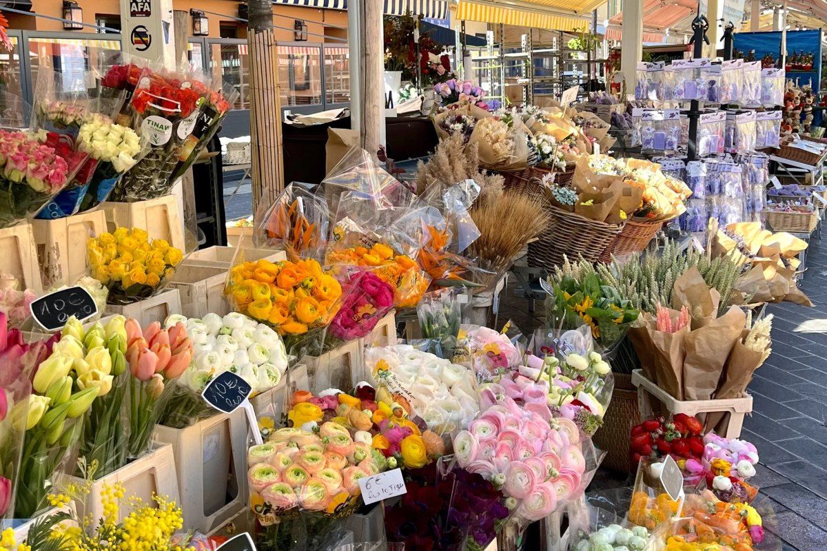 Buckets of tulips, ranunculus and dried flowers at the flower market on Cours Saleya, Vieux Nice