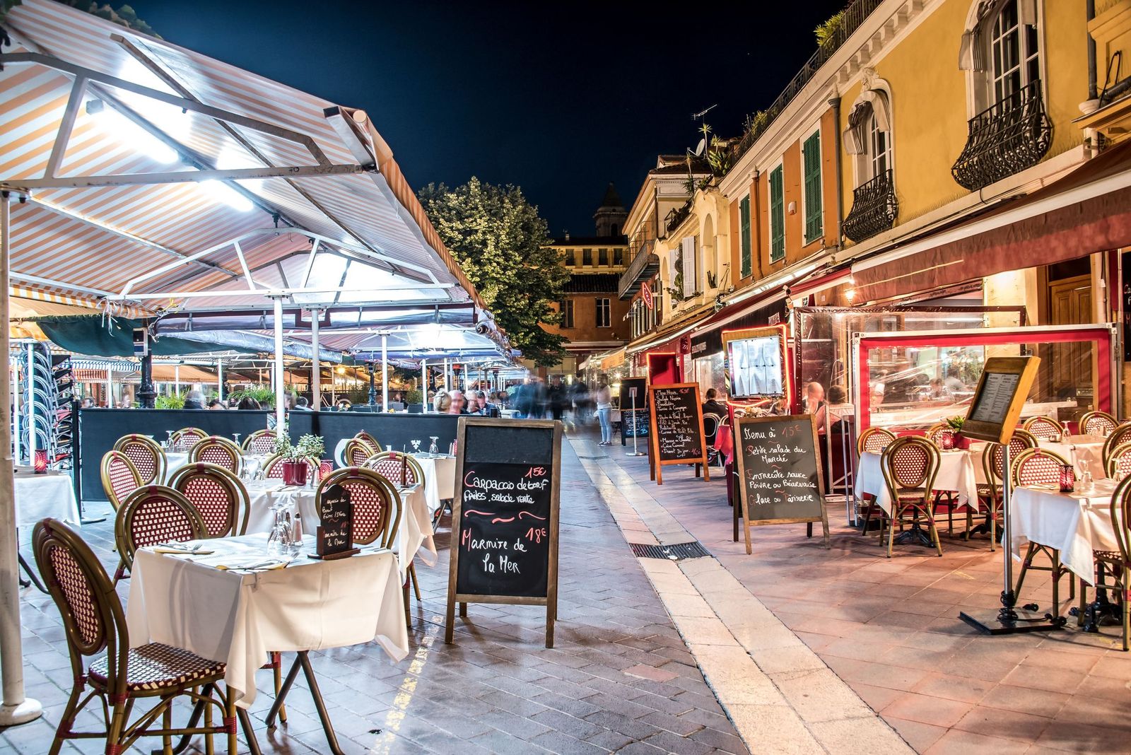 Restaurant terraces on the Cours Saleya at night, Nice